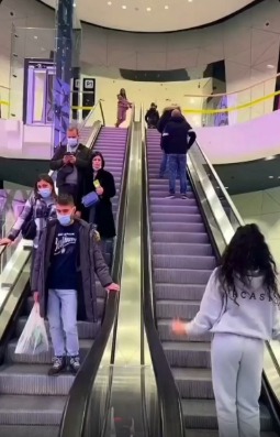 The lady coming down the escalator tripped 🤣😂🤣